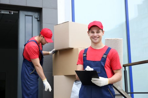 Trained removal staff carrying items with care and attention to safety