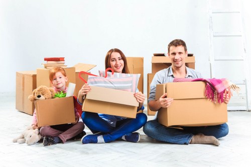 Professional movers demonstrating insurance-backed safety procedures during relocation