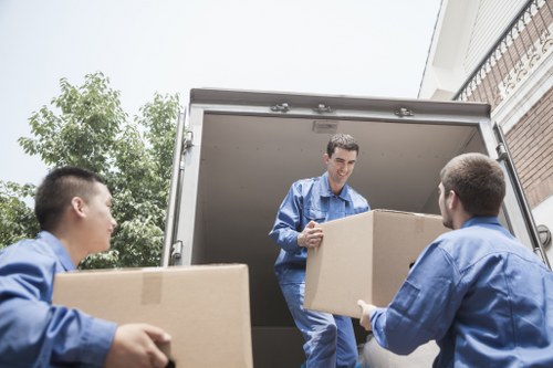 Local moving team packing boxes for a home move in Wandsworth