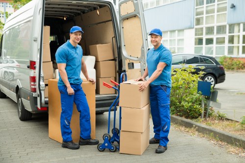 Professional movers loading furniture carefully during a Wandsworth relocation