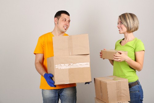 Removal team handling furniture safely in a moving service